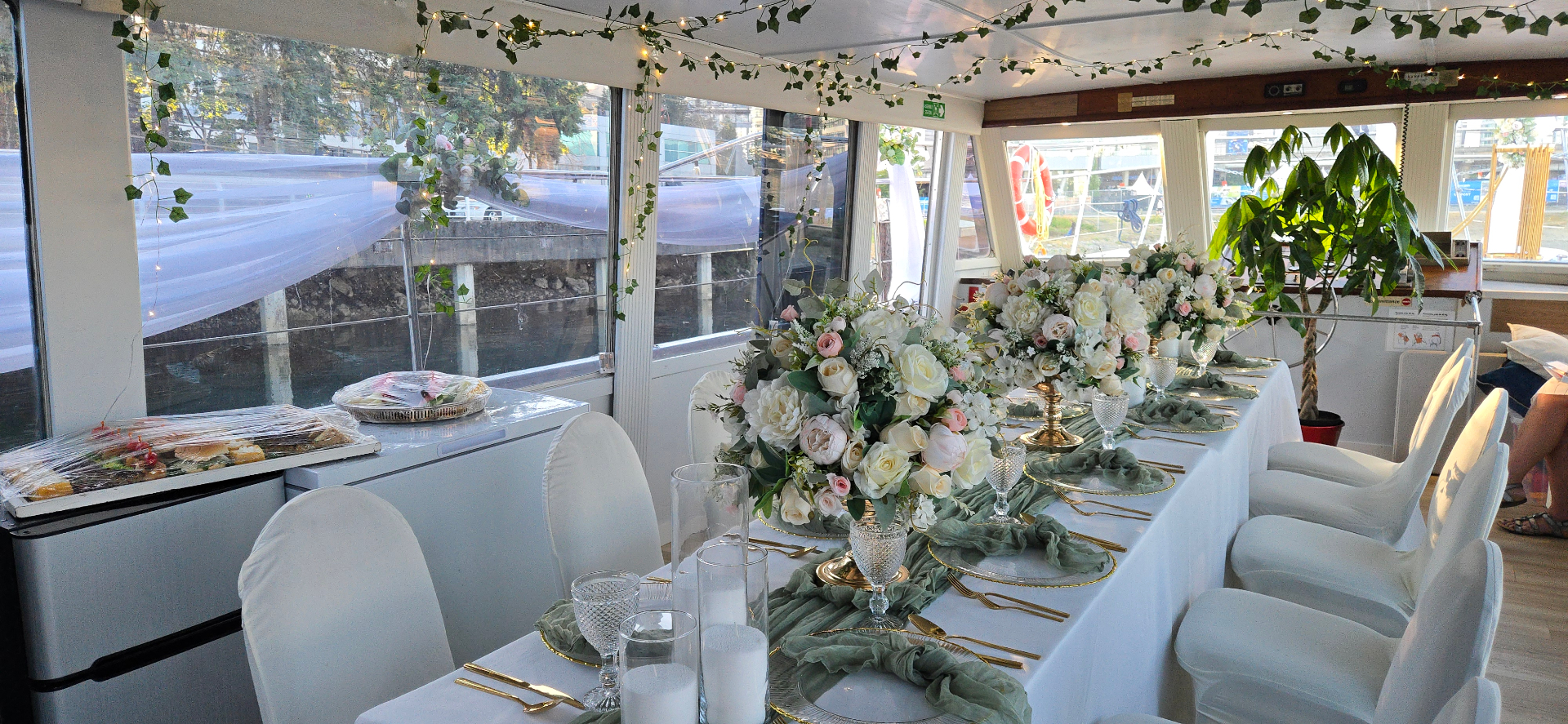 Shangri-La Joy interior set for a wedding reception with floral centerpieces