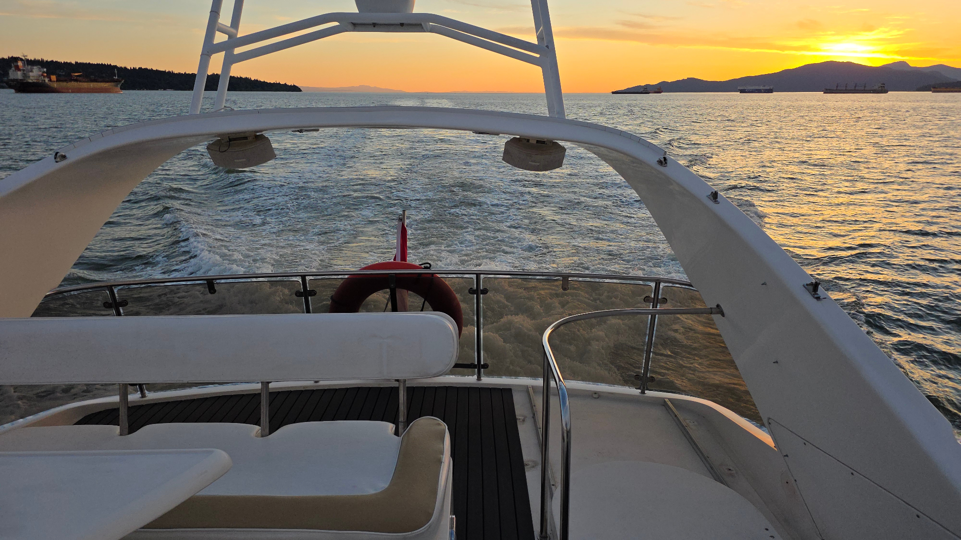 Summer Palace upper deck at sunset with wake behind