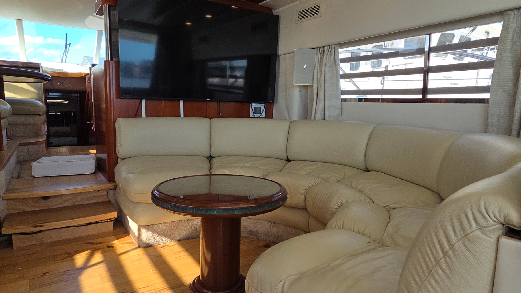 Summer Palace lounge with large TV and wraparound sofa